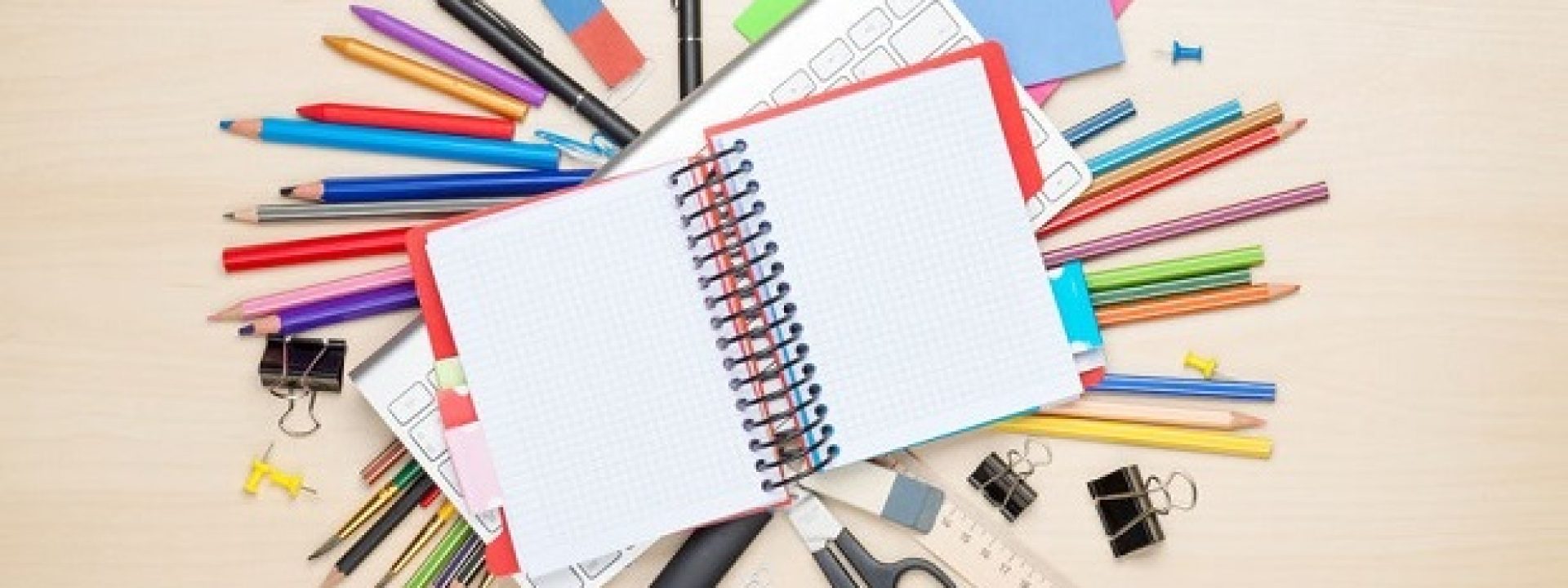 36349095 - blank notepad over school and office supplies on office table. top view with copy space